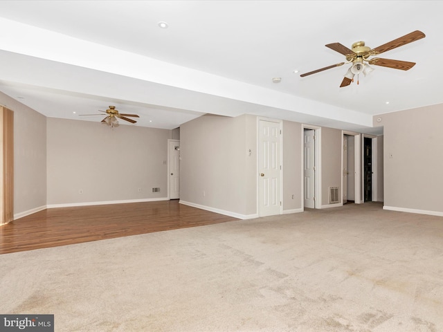 empty room featuring recessed lighting, visible vents, carpet flooring, ceiling fan, and baseboards