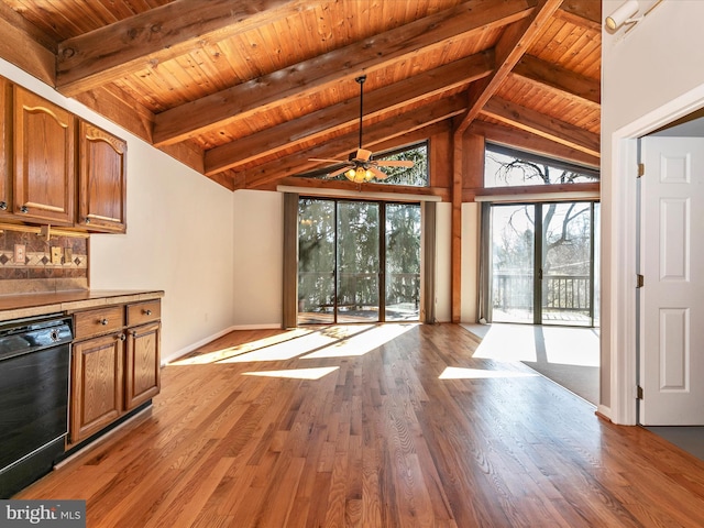 interior space with vaulted ceiling with beams, ceiling fan, wood finished floors, wooden ceiling, and baseboards