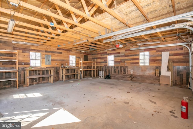 garage featuring a garage door opener and electric panel