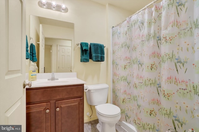 full bath with tile patterned flooring, curtained shower, vanity, and toilet