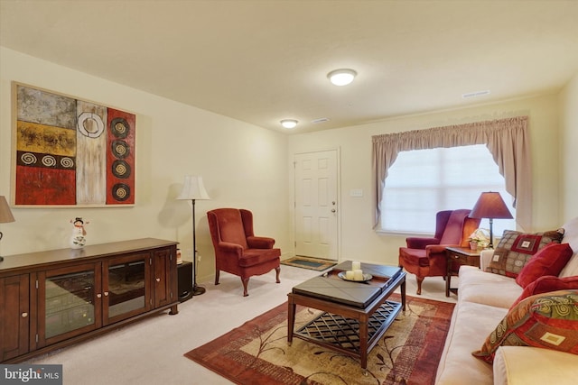 living area with carpet flooring and baseboards