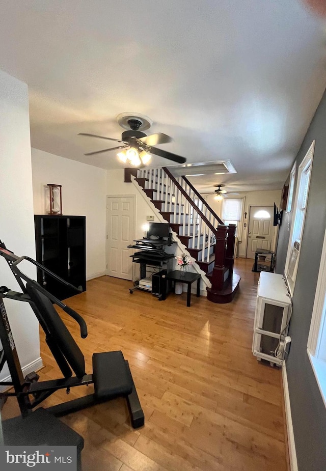 exercise room featuring ceiling fan and wood finished floors