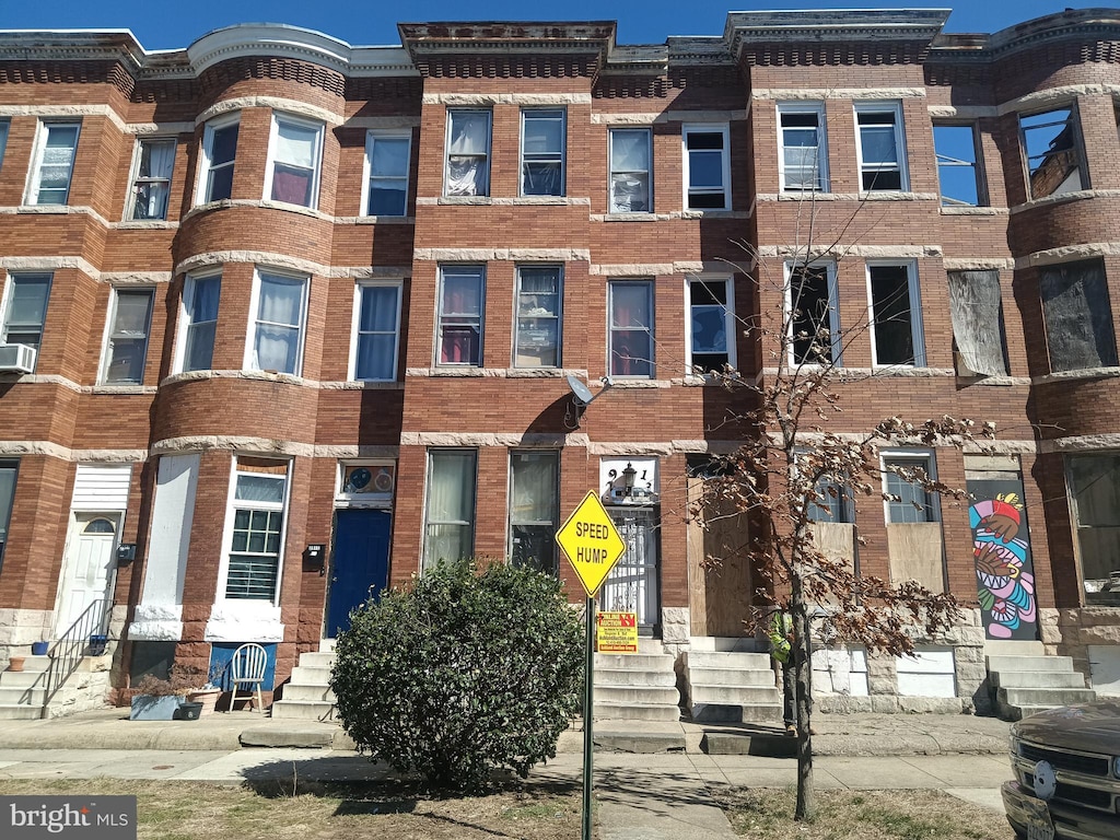 view of front of home featuring brick siding