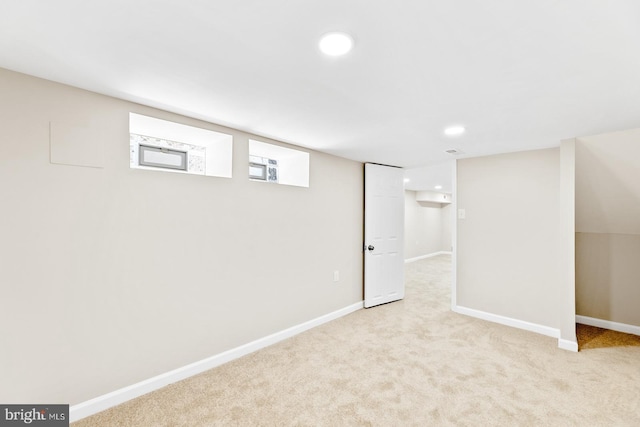 below grade area with carpet floors, baseboards, and recessed lighting