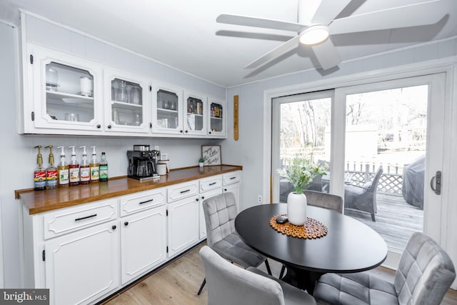 dining room featuring light wood-style floors and ceiling fan