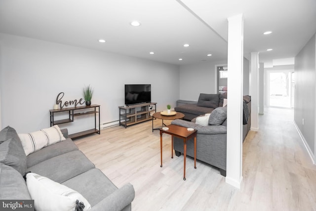 living room featuring light wood finished floors, recessed lighting, and baseboards