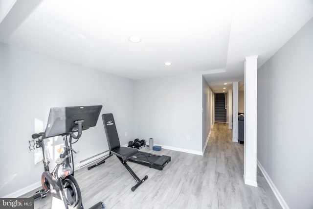 workout area with recessed lighting, wood finished floors, baseboards, and a baseboard radiator