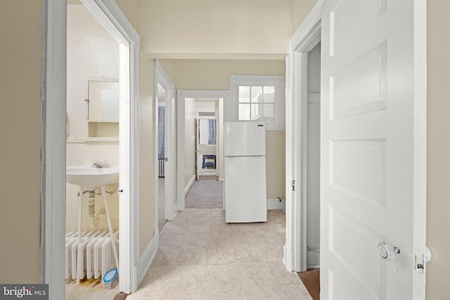 corridor featuring baseboards