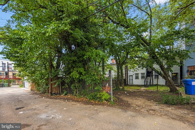 view of side of property with fence