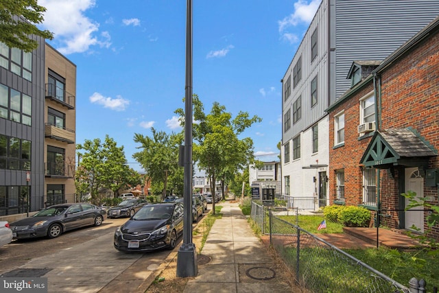 view of road with sidewalks and a residential view