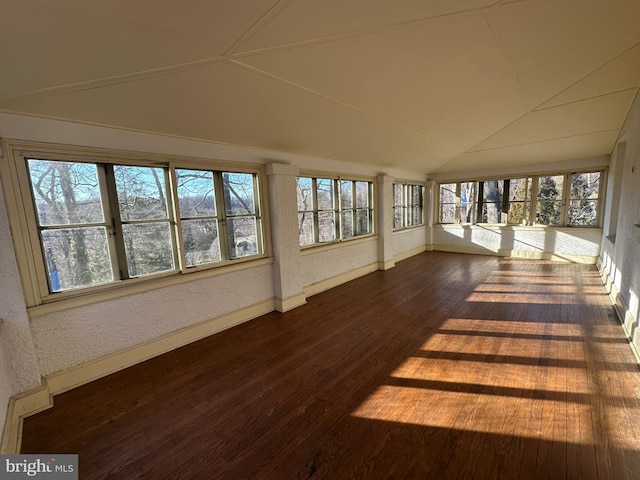 unfurnished sunroom featuring lofted ceiling