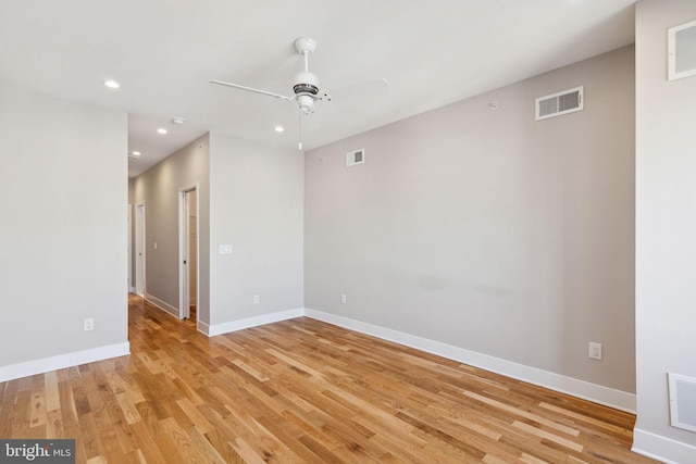 spare room with recessed lighting, baseboards, visible vents, and light wood finished floors