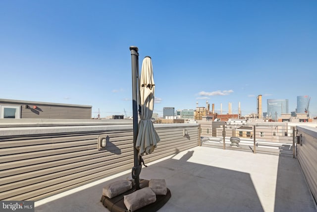 view of patio / terrace featuring a city view and a balcony