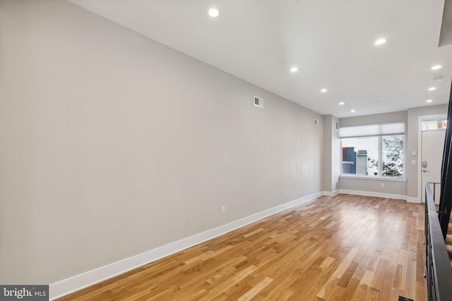 unfurnished living room with recessed lighting, visible vents, baseboards, and light wood-style flooring