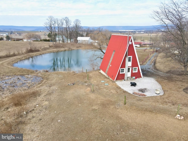 exterior space featuring a water and mountain view