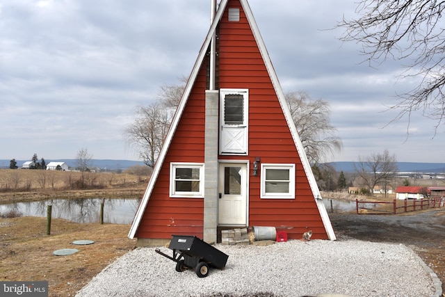 view of barn with a water view