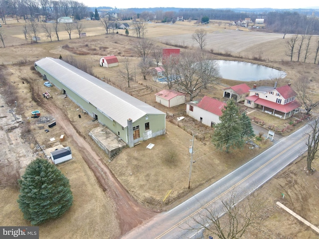 aerial view featuring a rural view and a water view