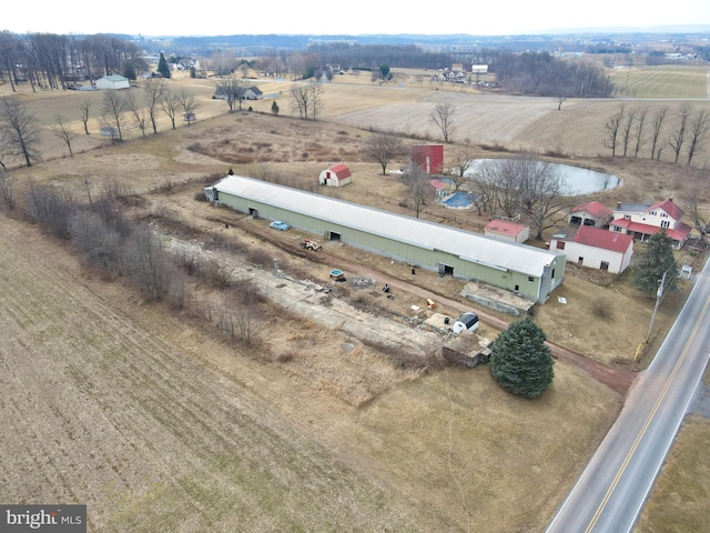 birds eye view of property featuring a rural view