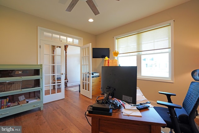 office space featuring recessed lighting, ceiling fan, wood finished floors, and french doors