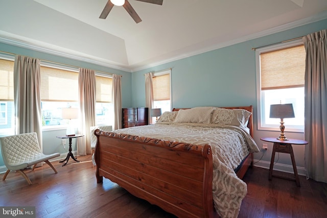 bedroom with dark wood-style flooring, vaulted ceiling, baseboards, and ceiling fan