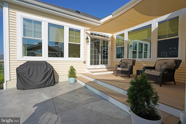 view of patio with outdoor lounge area and grilling area