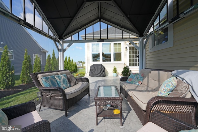 view of patio / terrace with an outdoor living space and a gazebo