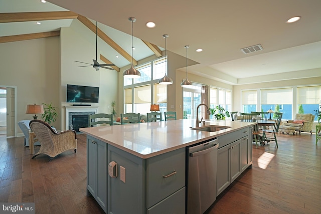 kitchen with visible vents, dishwasher, open floor plan, gray cabinets, and a sink