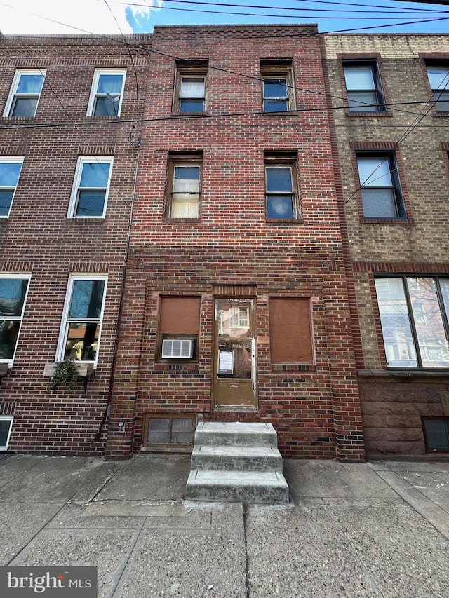 view of building exterior with entry steps