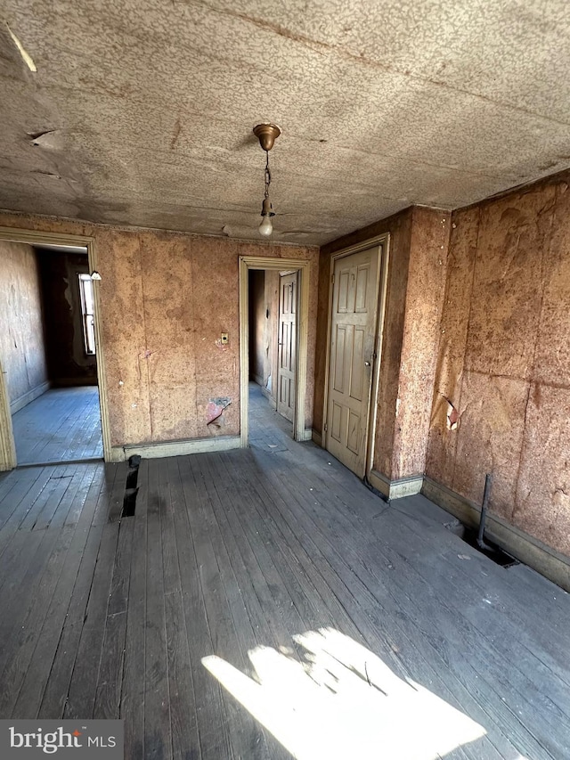 unfurnished room featuring dark wood finished floors