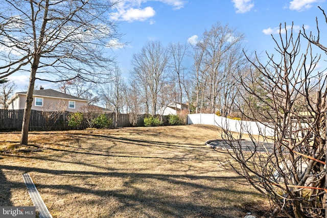 view of yard featuring fence