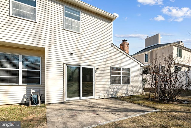 rear view of house with a patio