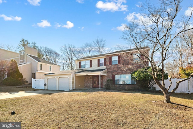 view of front facade featuring concrete driveway, brick siding, fence, and a front lawn