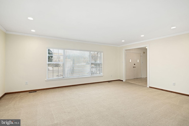 unfurnished room featuring crown molding, recessed lighting, visible vents, light carpet, and baseboards