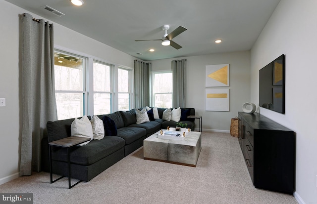 living room featuring baseboards, recessed lighting, visible vents, and light colored carpet