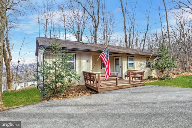 view of front of house featuring a wooden deck