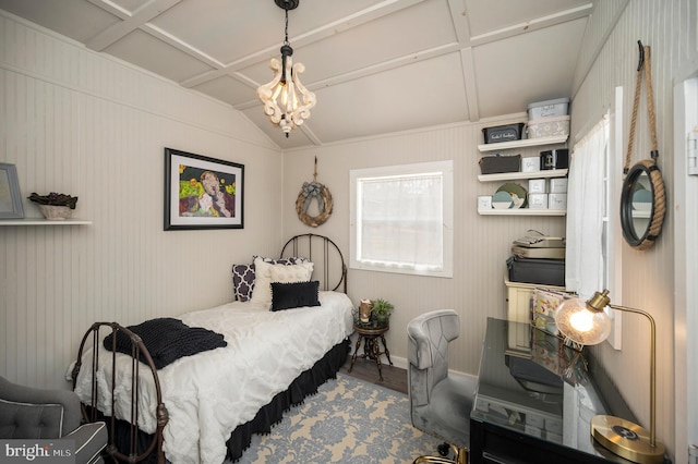 bedroom featuring lofted ceiling, coffered ceiling, a notable chandelier, and wood finished floors