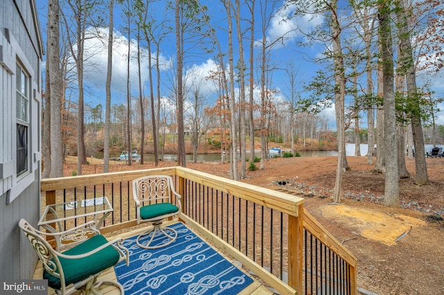 wooden deck with a water view