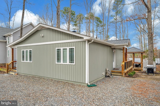 view of home's exterior featuring roof with shingles