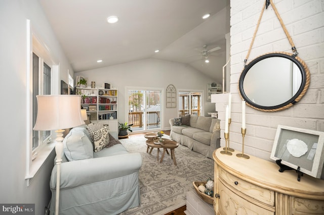 living room featuring lofted ceiling, ceiling fan, and recessed lighting