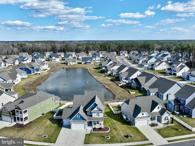 birds eye view of property featuring a residential view and a water view