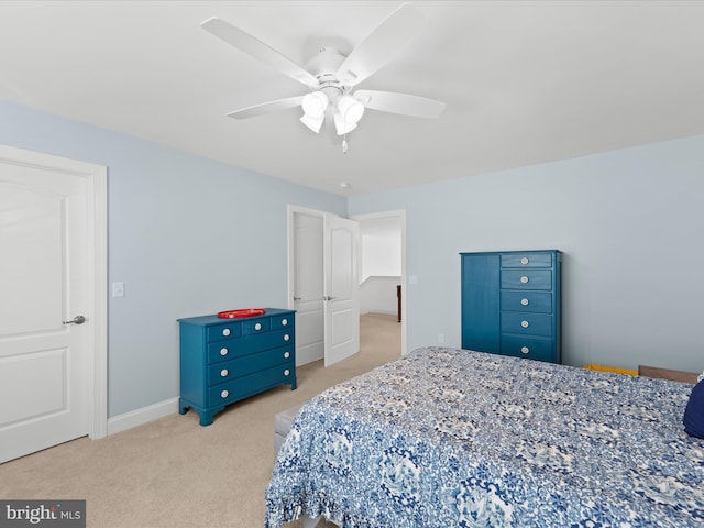 bedroom with baseboards, carpet floors, and a ceiling fan