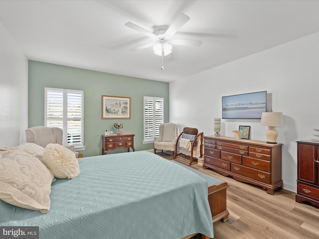 bedroom with ceiling fan and light wood-style floors