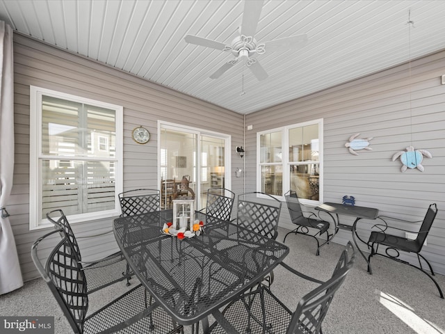 sunroom / solarium with a healthy amount of sunlight and ceiling fan