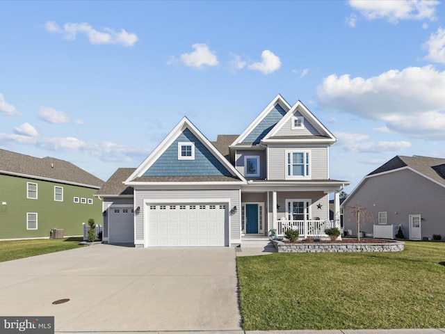 view of front of property featuring a garage, a porch, concrete driveway, and a front lawn