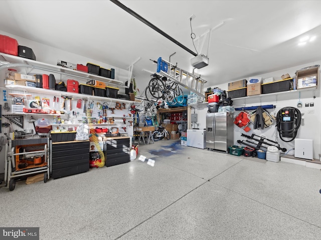 garage featuring a workshop area and a garage door opener