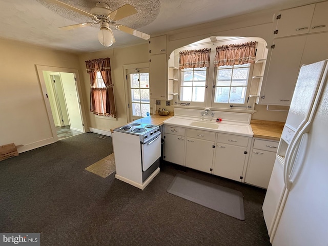 kitchen with open shelves, light countertops, a ceiling fan, white cabinetry, and white appliances