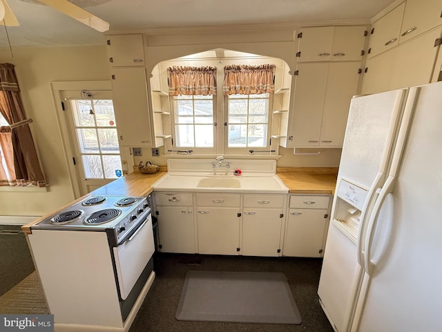 kitchen with open shelves, light countertops, white cabinetry, white appliances, and a peninsula