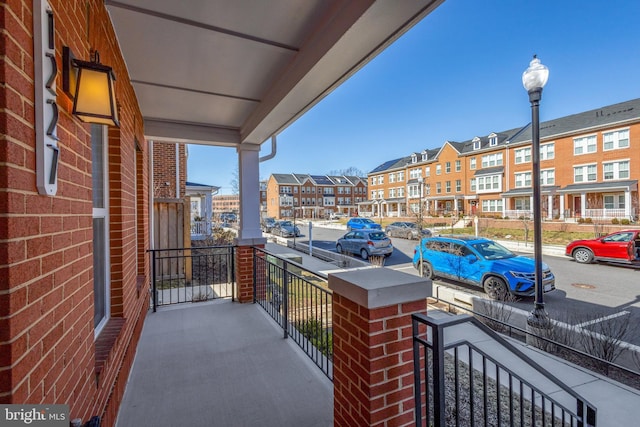 balcony featuring a residential view