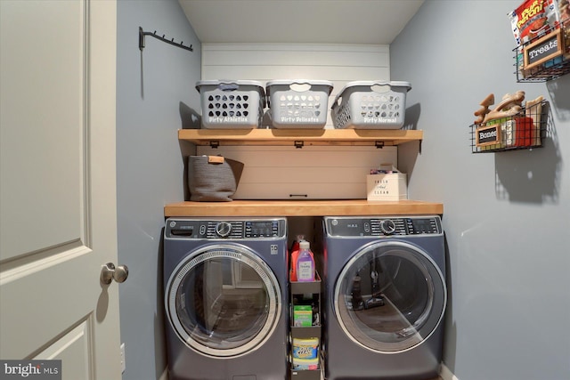 washroom featuring laundry area and washing machine and dryer