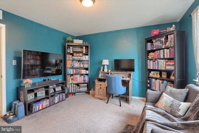 carpeted office featuring baseboards